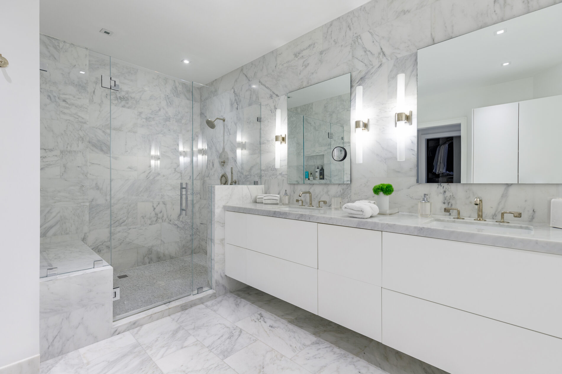 Photoshoot Footage located in Florida, USA. Clean, modern bathroom with refreshing shower, reflecting mirror, Bathtub and sleek tiles.